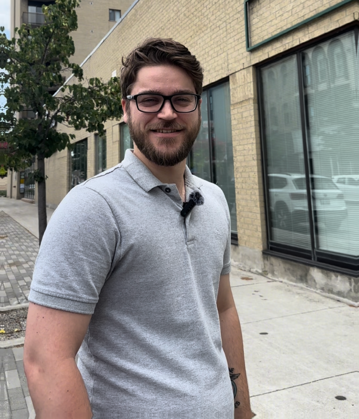 Kyle Yates standing on a downtown St. Thomas street
